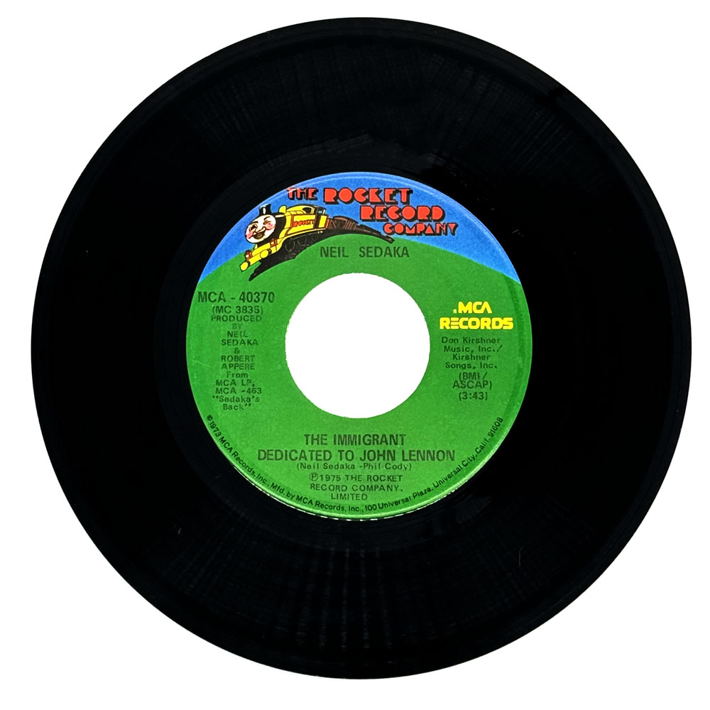 Neil Sedaka : THE IMMIGRANT DEDICATED TO JOHN LENNON/ HEY MISTER SUNSHINE